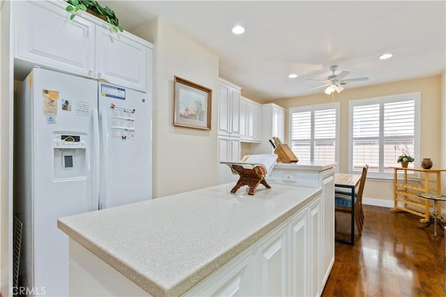 2747 Traditions Loop, Paso Robles, CA 93446 - kitchen featuring white refrigerator with ice dispenser, a ceiling fan, a kitchen island, dark wood-style floors, and white cabinets
