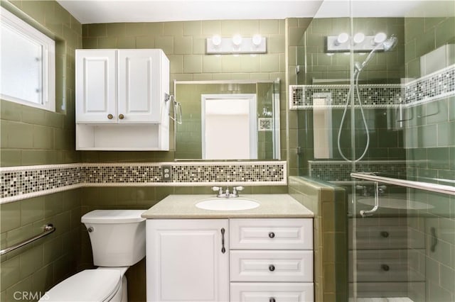 10402 Oronsay Cir, Huntington Beach, CA 92646 - full bathroom with vanity, a stall shower, and tile walls