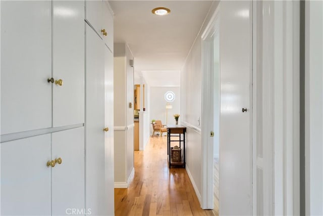 10402 Oronsay Cir, Huntington Beach, CA 92646 - corridor with light wood-style flooring and baseboards