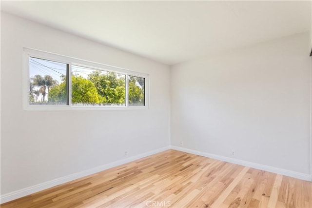 10402 Oronsay Cir, Huntington Beach, CA 92646 - empty room featuring light wood-style floors and baseboards