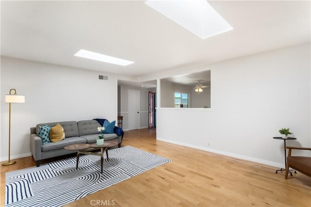 10402 Oronsay Cir, Huntington Beach, CA 92646 - living area with a skylight and light wood-style floors