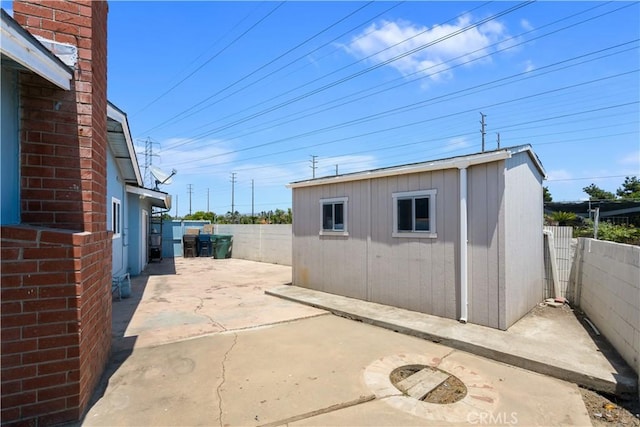 10402 Oronsay Cir, Huntington Beach, CA 92646 - fenced backyard with a patio area and a storage shed