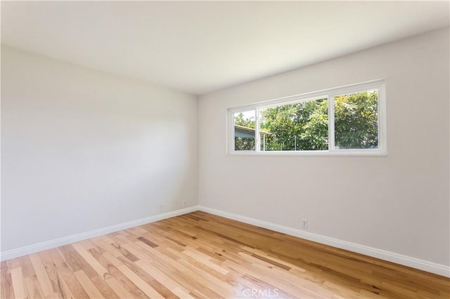 10402 Oronsay Cir, Huntington Beach, CA 92646 - empty room featuring light wood-type flooring and baseboards