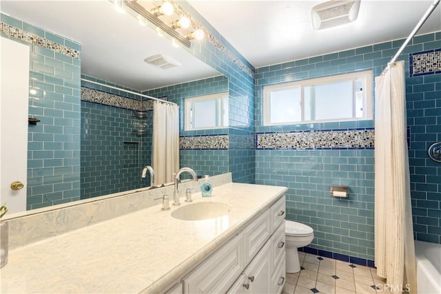 10402 Oronsay Cir, Huntington Beach, CA 92646 - bathroom with tile patterned flooring, tile walls, vanity, and shower / bath combination with curtain