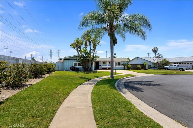 10402 Oronsay Cir, Huntington Beach, CA 92646 - view of front of property with a front yard and board and batten siding