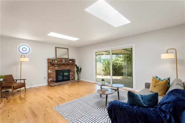 10402 Oronsay Cir, Huntington Beach, CA 92646 - living room featuring a skylight, light wood finished floors, and a fireplace