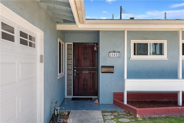 10402 Oronsay Cir, Huntington Beach, CA 92646 - doorway to property featuring stucco siding and a porch
