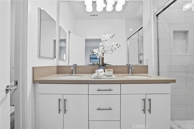 536 Caleigh Ln, Costa Mesa, CA 92627 - bathroom with double vanity, a stall shower, and toilet