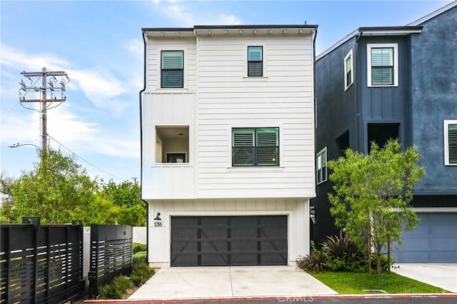 536 Caleigh Ln, Costa Mesa, CA 92627 - view of front facade featuring a garage, board and batten siding, and driveway