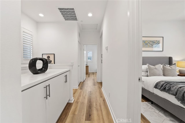 536 Caleigh Ln, Costa Mesa, CA 92627 - hall featuring light wood-type flooring, recessed lighting, attic access, and baseboards