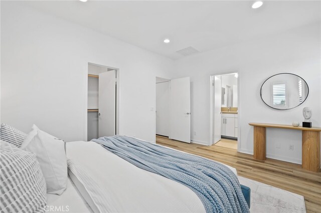 536 Caleigh Ln, Costa Mesa, CA 92627 - bedroom featuring light wood-style floors, recessed lighting, ensuite bathroom, and baseboards