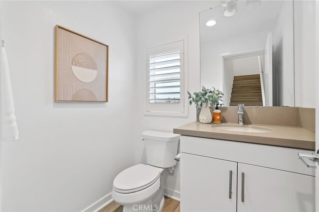 536 Caleigh Ln, Costa Mesa, CA 92627 - bathroom with vanity, toilet, baseboards, and wood finished floors