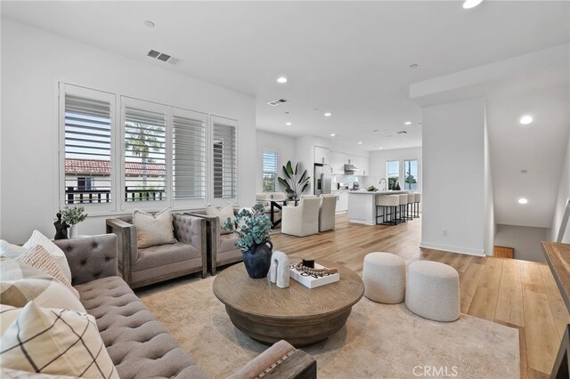 536 Caleigh Ln, Costa Mesa, CA 92627 - living room with light wood-style floors and recessed lighting