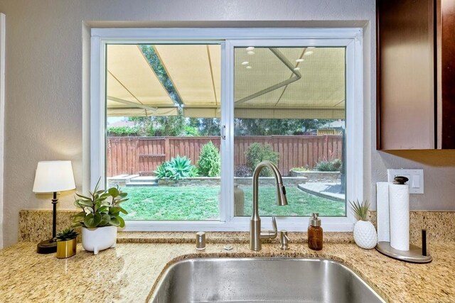 5431 Stirrup Way, Oceanside, CA 92057 - kitchen view of a textured wall and light stone countertops