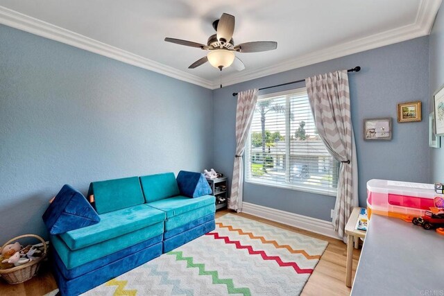 5431 Stirrup Way, Oceanside, CA 92057 - living area with wood finished floors, ornamental molding, and ceiling fan