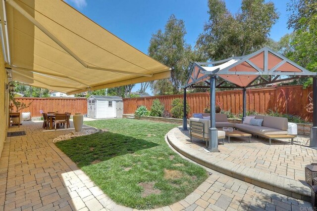 5431 Stirrup Way, Oceanside, CA 92057 - fenced backyard with an outdoor living space, a storage shed, a patio area, and outdoor dining area