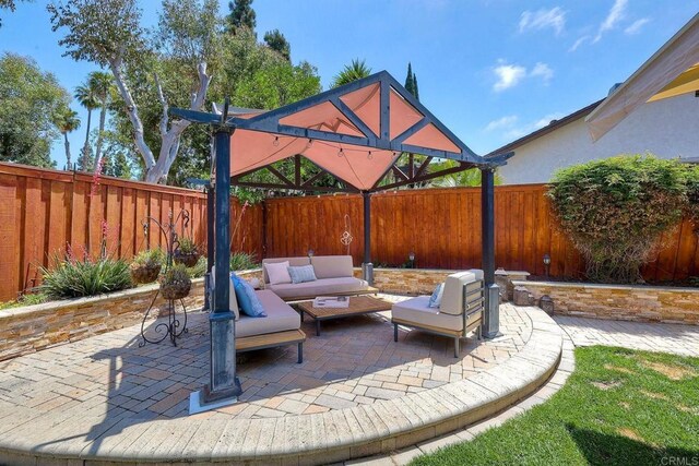 5431 Stirrup Way, Oceanside, CA 92057 - fenced backyard featuring an outdoor living space and a patio area
