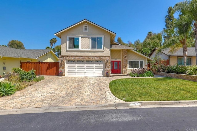 5431 Stirrup Way, Oceanside, CA 92057 - view of front of house with stone siding, stucco siding, an attached garage, and decorative driveway