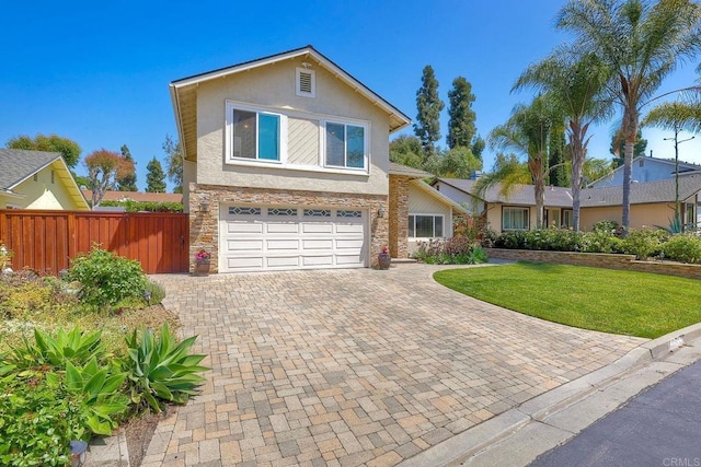 5431 Stirrup Way, Oceanside, CA 92057 - traditional-style house featuring stucco siding, stone siding, a garage, and decorative driveway