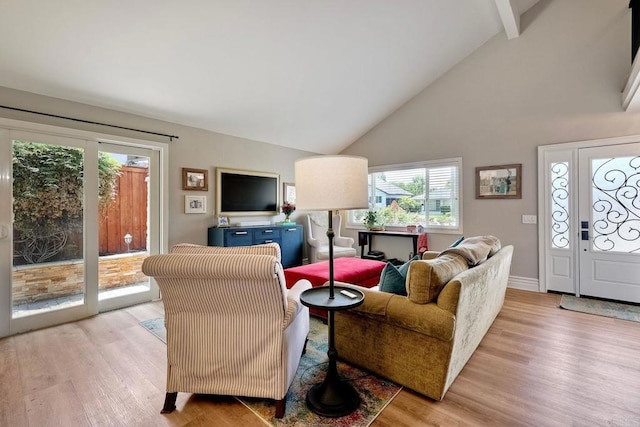 5431 Stirrup Way, Oceanside, CA 92057 - living room featuring plenty of natural light, light wood-style floors, beam ceiling, and high vaulted ceiling