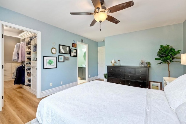 5431 Stirrup Way, Oceanside, CA 92057 - bedroom with a spacious closet, light wood-type flooring, ensuite bathroom, ceiling fan, and a closet