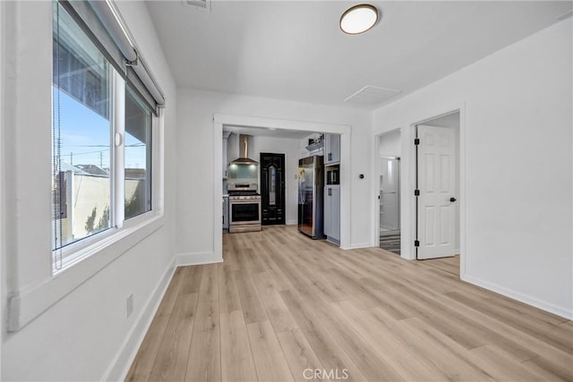 210 Amabel St, Los Angeles, CA 90065 - unfurnished living room featuring light wood-type flooring and baseboards
