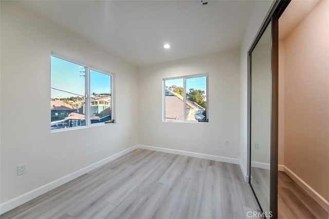 210 Amabel St, Los Angeles, CA 90065 - unfurnished bedroom featuring light wood-style floors, multiple windows, and recessed lighting