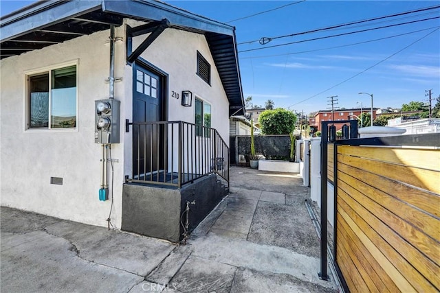210 Amabel St, Los Angeles, CA 90065 - view of side of home featuring stucco siding and crawl space