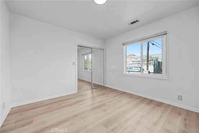 210 Amabel St, Los Angeles, CA 90065 - unfurnished bedroom with light wood-style flooring and a closet