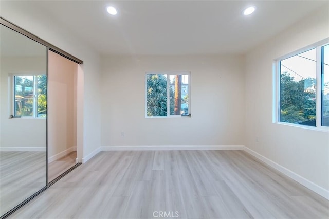 210 Amabel St, Los Angeles, CA 90065 - unfurnished bedroom featuring light wood-style floors, recessed lighting, and a closet