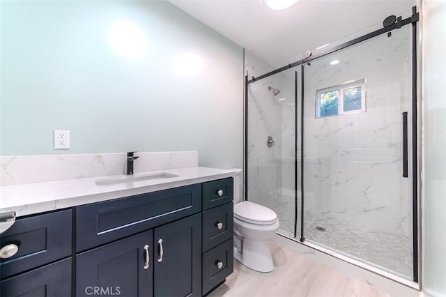 210 Amabel St, Los Angeles, CA 90065 - bathroom featuring vanity, a marble finish shower, and wood finished floors