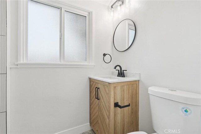 8115 Etiwanda Ave, Reseda, CA 91335 - bathroom with vanity, toilet, and baseboards