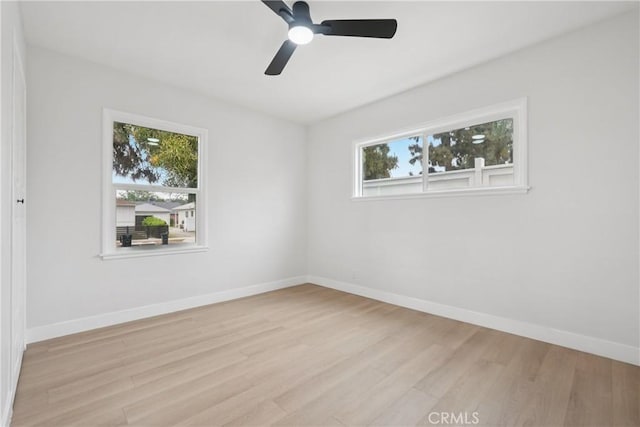 8115 Etiwanda Ave, Reseda, CA 91335 - empty room with healthy amount of natural light, wood finished floors, and baseboards