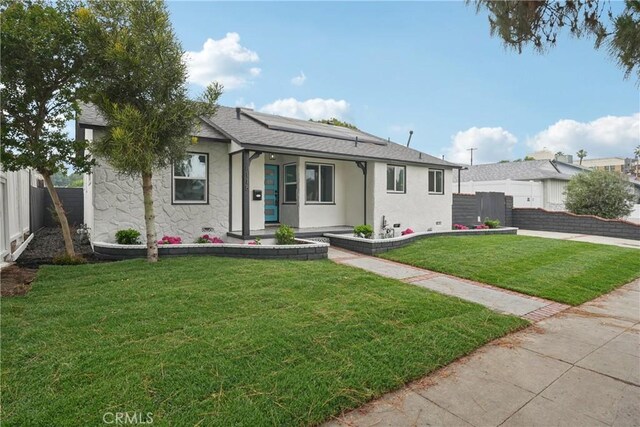 8115 Etiwanda Ave, Reseda, CA 91335 - bungalow with roof mounted solar panels and stucco siding