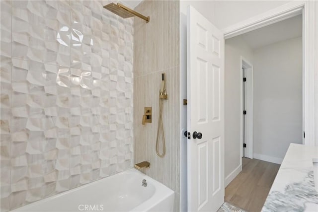 8115 Etiwanda Ave, Reseda, CA 91335 - full bathroom featuring shower / tub combination, wood finished floors, and baseboards