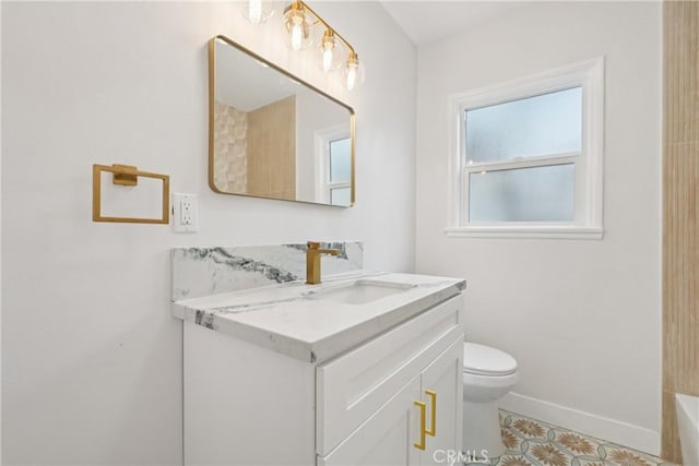 8115 Etiwanda Ave, Reseda, CA 91335 - bathroom with vanity, toilet, a tub, baseboards, and tile patterned flooring