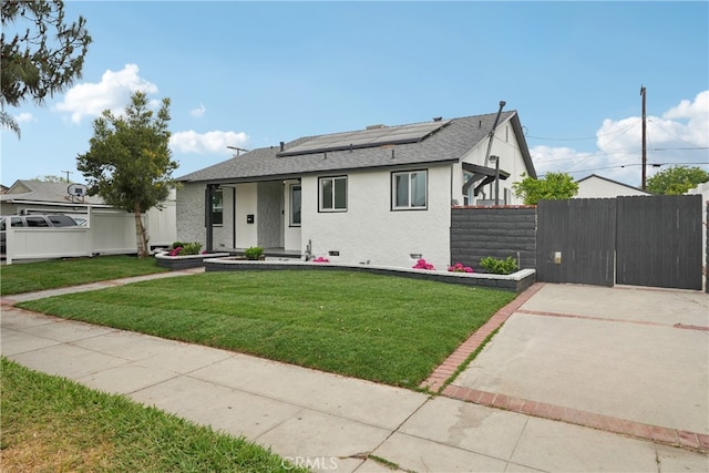 8115 Etiwanda Ave, Reseda, CA 91335 - view of front of home with solar panels, stucco siding, a gate, and roof with shingles