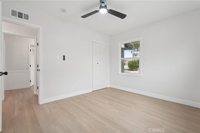 8115 Etiwanda Ave, Reseda, CA 91335 - unfurnished bedroom featuring light wood-style floors, a closet, baseboards, and ceiling fan