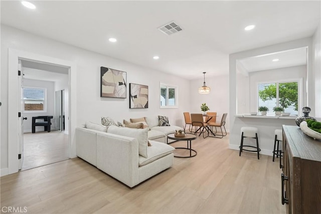 8115 Etiwanda Ave, Reseda, CA 91335 - living area with light wood-style flooring, healthy amount of natural light, recessed lighting, and baseboards