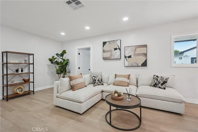 8115 Etiwanda Ave, Reseda, CA 91335 - living room featuring light wood-style flooring, baseboards, and recessed lighting