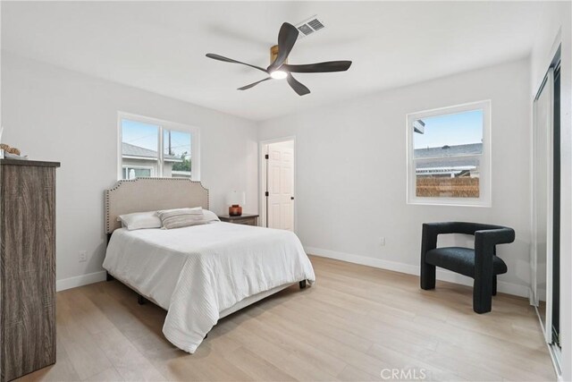8115 Etiwanda Ave, Reseda, CA 91335 - bedroom featuring light wood-style flooring, baseboards, and ceiling fan