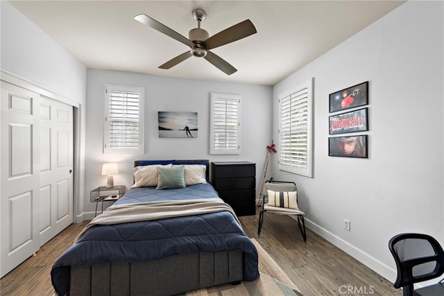 9 Reese Crk, Ladera Ranch, CA 92694 - bedroom featuring baseboards, multiple windows, wood finished floors, and a ceiling fan