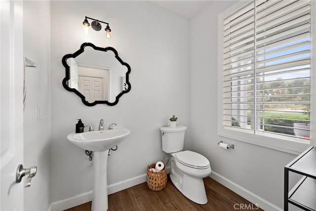 9 Reese Crk, Ladera Ranch, CA 92694 - bathroom featuring wood finished floors, toilet, baseboards, and a sink