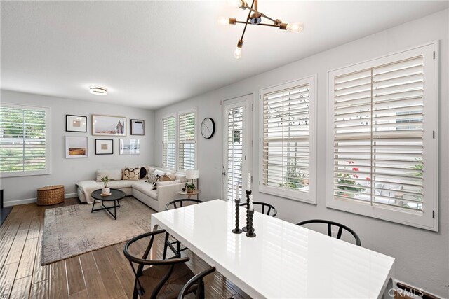 9 Reese Crk, Ladera Ranch, CA 92694 - dining space featuring wood finished floors, a chandelier, and baseboards
