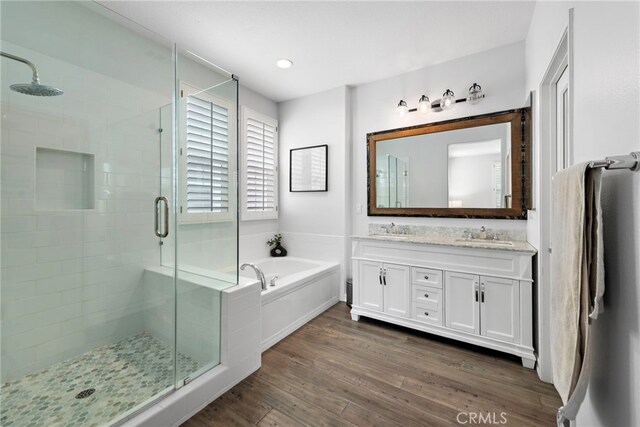 9 Reese Crk, Ladera Ranch, CA 92694 - bathroom with a shower stall, a garden tub, double vanity, and wood finished floors