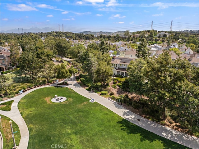 9 Reese Crk, Ladera Ranch, CA 92694 - aerial overview of property's location with nearby suburban area, mountains, and a tree filled landscape
