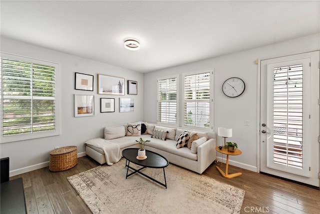 9 Reese Crk, Ladera Ranch, CA 92694 - living room with healthy amount of natural light, wood finished floors, and baseboards