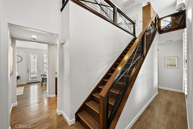 9 Reese Crk, Ladera Ranch, CA 92694 - stairs featuring hardwood / wood-style floors and baseboards