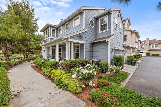 9 Reese Crk, Ladera Ranch, CA 92694 - view of home's exterior with asphalt driveway, a garage, and cooling unit