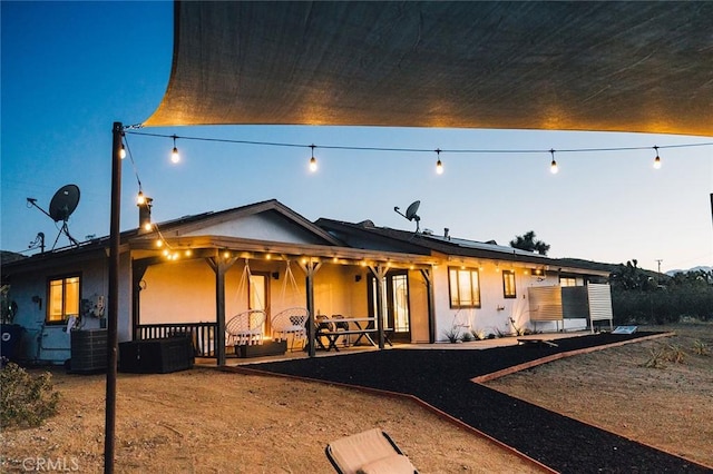 58250 Sierra Vista Dr, Yucca Valley, CA 92284 - rear view of property with stucco siding and central AC